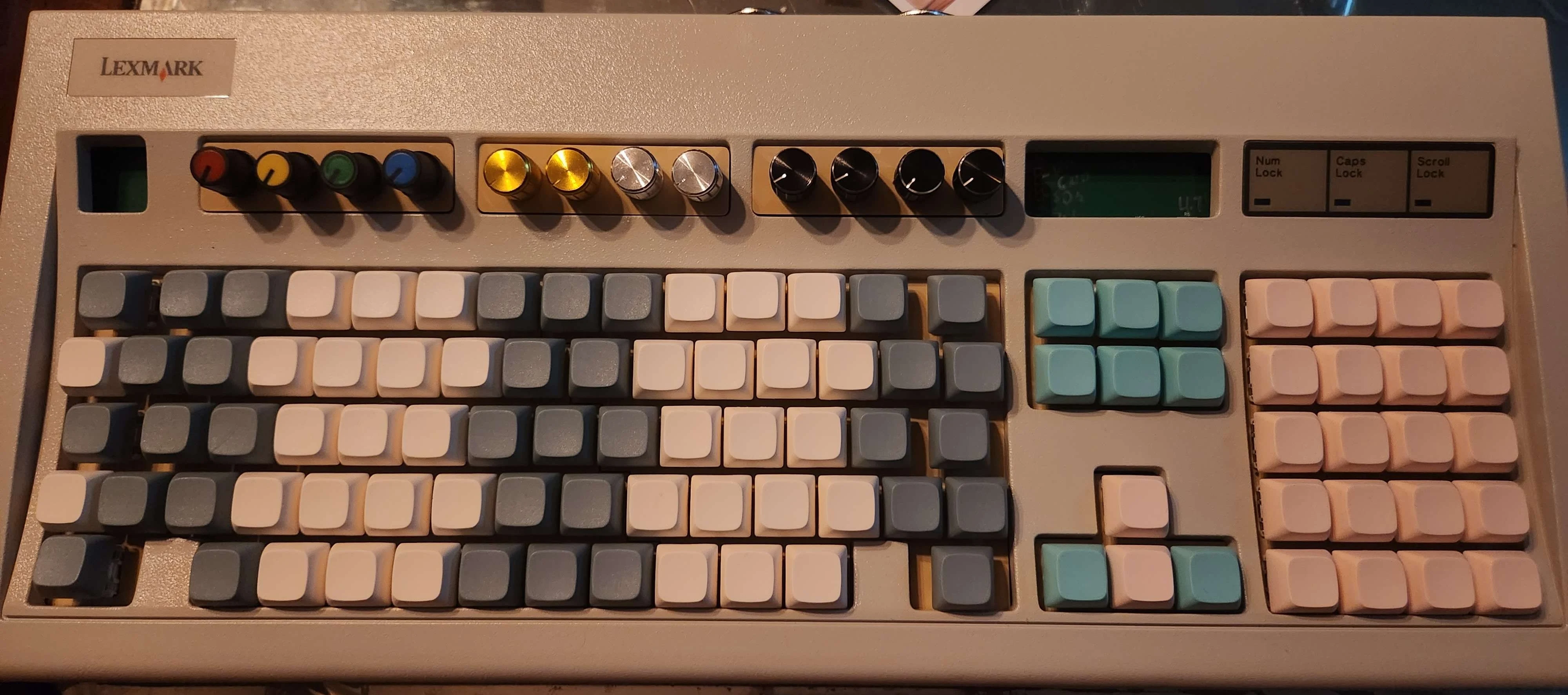 The finished Model M MIDI instrument with colored key groups and rotary controls